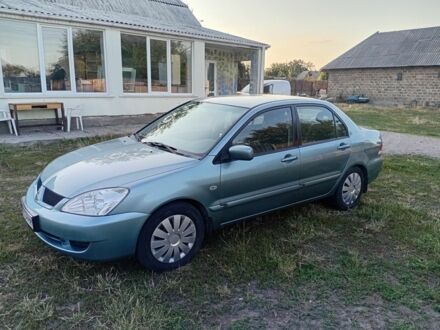 Мицубиси Лансер 2007 в Кагарлыке на Automoto.ua Зеленый Мицубиси Лансер, объемом двигателя 1.6 л и пробегом 211 тыс. км за 4200 $, фото 1 на Automoto.ua