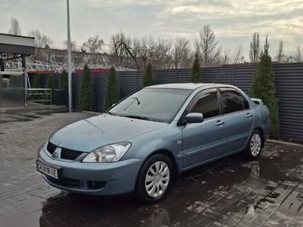 Зеленый Мицубиси Лансер, объемом двигателя 1.6 л и пробегом 165 тыс. км за 5500 $, фото 1 на Automoto.ua