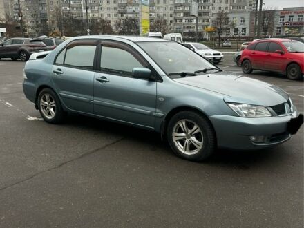 Зеленый Мицубиси Лансер, объемом двигателя 1.6 л и пробегом 234 тыс. км за 5300 $, фото 1 на Automoto.ua