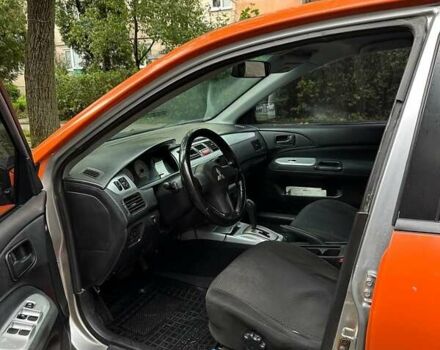 Оранжевый Мицубиси Лансер, объемом двигателя 1.59 л и пробегом 321 тыс. км за 5000 $, фото 1 на Automoto.ua