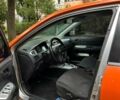 Оранжевый Мицубиси Лансер, объемом двигателя 1.59 л и пробегом 321 тыс. км за 5000 $, фото 1 на Automoto.ua