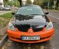 Оранжевый Мицубиси Лансер, объемом двигателя 1.59 л и пробегом 325 тыс. км за 4300 $, фото 1 на Automoto.ua
