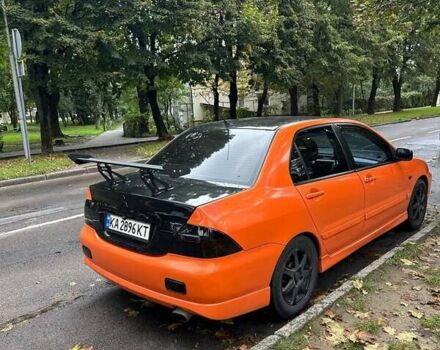 Оранжевый Мицубиси Лансер, объемом двигателя 1.59 л и пробегом 321 тыс. км за 5000 $, фото 6 на Automoto.ua