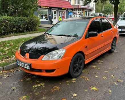 Оранжевый Мицубиси Лансер, объемом двигателя 1.59 л и пробегом 325 тыс. км за 4300 $, фото 1 на Automoto.ua