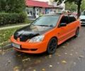 Оранжевый Мицубиси Лансер, объемом двигателя 1.59 л и пробегом 325 тыс. км за 4300 $, фото 1 на Automoto.ua