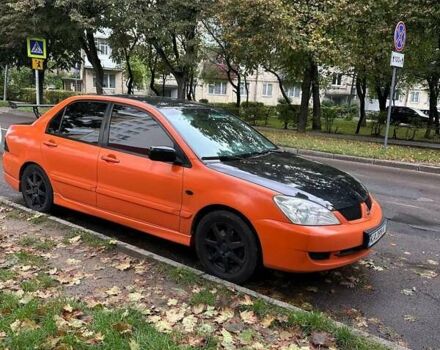 Оранжевый Мицубиси Лансер, объемом двигателя 1.59 л и пробегом 325 тыс. км за 4300 $, фото 3 на Automoto.ua