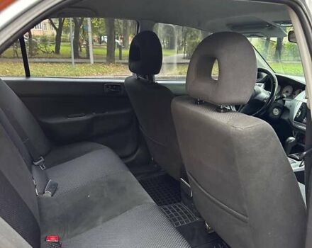 Оранжевый Мицубиси Лансер, объемом двигателя 1.59 л и пробегом 321 тыс. км за 5000 $, фото 2 на Automoto.ua