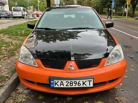 Оранжевый Мицубиси Лансер, объемом двигателя 1.59 л и пробегом 325 тыс. км за 4300 $, фото 1 на Automoto.ua