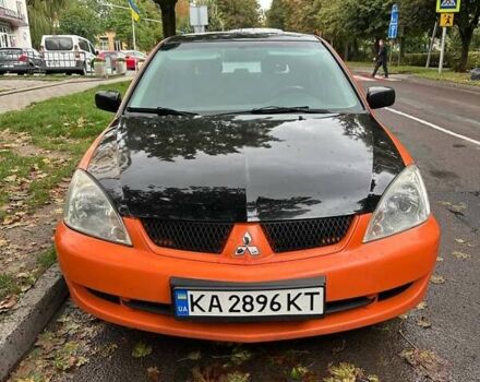 Оранжевый Мицубиси Лансер, объемом двигателя 1.59 л и пробегом 325 тыс. км за 4300 $, фото 1 на Automoto.ua