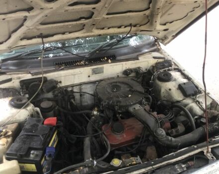 Белый Мицубиси Мираж, объемом двигателя 1.3 л и пробегом 283 тыс. км за 350 $, фото 4 на Automoto.ua