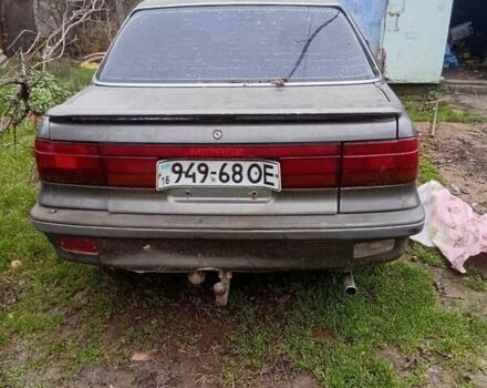 Серый Мицубиси Мираж, объемом двигателя 1.5 л и пробегом 400 тыс. км за 500 $, фото 1 на Automoto.ua