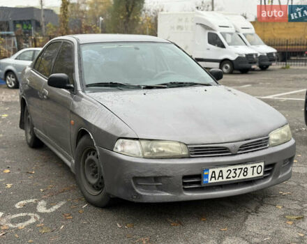 Серый Мицубиси Мираж, объемом двигателя 1.8 л и пробегом 300 тыс. км за 2100 $, фото 1 на Automoto.ua