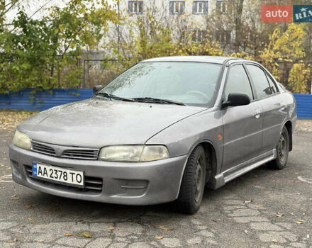 Серый Мицубиси Мираж, объемом двигателя 1.8 л и пробегом 300 тыс. км за 2100 $, фото 1 на Automoto.ua