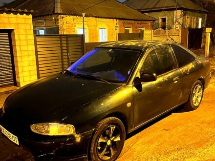 Зеленый Мицубиси Мираж, объемом двигателя 1.5 л и пробегом 165 тыс. км за 1900 $, фото 1 на Automoto.ua