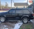 Черный Мицубиси Монтеро, объемом двигателя 3 л и пробегом 100 тыс. км за 11000 $, фото 1 на Automoto.ua