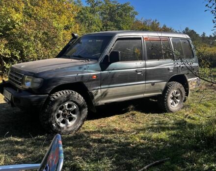 Зеленый Мицубиси Монтеро, объемом двигателя 3 л и пробегом 300 тыс. км за 5999 $, фото 1 на Automoto.ua