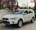 Белый Мицубиси Аутлендер ХЛ, объемом двигателя 2 л и пробегом 225 тыс. км за 10999 $, фото 1 на Automoto.ua