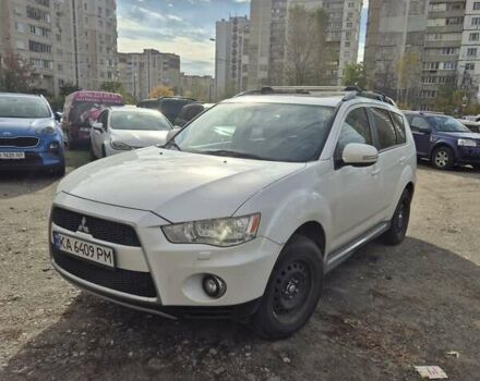 Белый Мицубиси Аутлендер ХЛ, объемом двигателя 2.18 л и пробегом 142 тыс. км за 14000 $, фото 1 на Automoto.ua