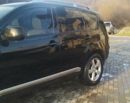 Черный Мицубиси Аутлендер ХЛ, объемом двигателя 3 л и пробегом 130 тыс. км за 6000 $, фото 3 на Automoto.ua