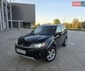 Черный Мицубиси Аутлендер ХЛ, объемом двигателя 3 л и пробегом 150 тыс. км за 9500 $, фото 1 на Automoto.ua