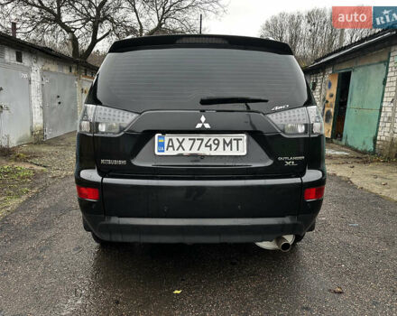 Черный Мицубиси Аутлендер ХЛ, объемом двигателя 2.4 л и пробегом 283 тыс. км за 8900 $, фото 6 на Automoto.ua