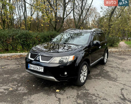 Черный Мицубиси Аутлендер ХЛ, объемом двигателя 2.4 л и пробегом 230 тыс. км за 8500 $, фото 1 на Automoto.ua
