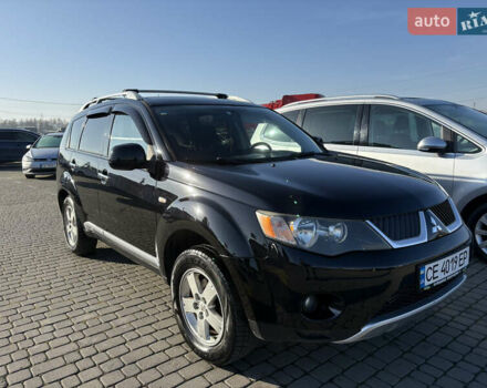 Черный Мицубиси Аутлендер ХЛ, объемом двигателя 2 л и пробегом 264 тыс. км за 7950 $, фото 1 на Automoto.ua