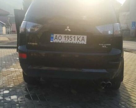 Черный Мицубиси Аутлендер ХЛ, объемом двигателя 3 л и пробегом 130 тыс. км за 6000 $, фото 2 на Automoto.ua