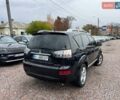 Черный Мицубиси Аутлендер ХЛ, объемом двигателя 3 л и пробегом 245 тыс. км за 9300 $, фото 2 на Automoto.ua