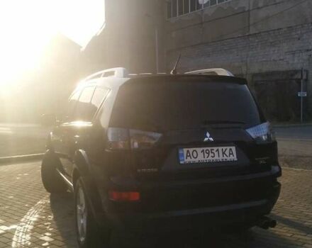 Черный Мицубиси Аутлендер ХЛ, объемом двигателя 3 л и пробегом 130 тыс. км за 6000 $, фото 1 на Automoto.ua