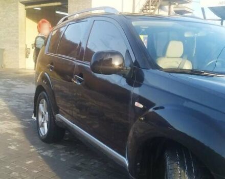 Черный Мицубиси Аутлендер ХЛ, объемом двигателя 3 л и пробегом 130 тыс. км за 6000 $, фото 4 на Automoto.ua