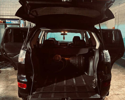 Черный Мицубиси Аутлендер ХЛ, объемом двигателя 3 л и пробегом 253 тыс. км за 9800 $, фото 1 на Automoto.ua