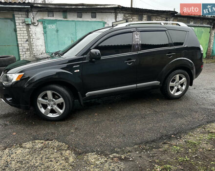 Черный Мицубиси Аутлендер ХЛ, объемом двигателя 2.4 л и пробегом 283 тыс. км за 8900 $, фото 4 на Automoto.ua