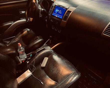 Черный Мицубиси Аутлендер ХЛ, объемом двигателя 3 л и пробегом 253 тыс. км за 9800 $, фото 4 на Automoto.ua