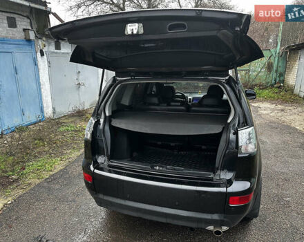 Черный Мицубиси Аутлендер ХЛ, объемом двигателя 2.4 л и пробегом 283 тыс. км за 8900 $, фото 24 на Automoto.ua