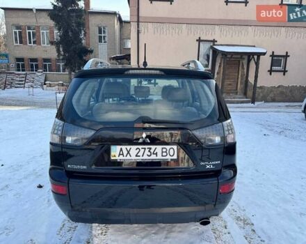 Черный Мицубиси Аутлендер ХЛ, объемом двигателя 2.36 л и пробегом 170 тыс. км за 10500 $, фото 2 на Automoto.ua