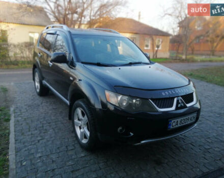 Чорний Міцубісі Аутлендер ХЛ, об'ємом двигуна 2.38 л та пробігом 228 тис. км за 7850 $, фото 1 на Automoto.ua