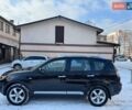 Черный Мицубиси Аутлендер ХЛ, объемом двигателя 2.36 л и пробегом 170 тыс. км за 10500 $, фото 1 на Automoto.ua