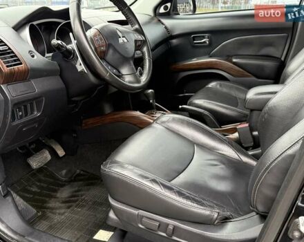 Черный Мицубиси Аутлендер ХЛ, объемом двигателя 2.36 л и пробегом 175 тыс. км за 9700 $, фото 10 на Automoto.ua