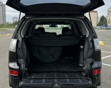 Черный Мицубиси Аутлендер ХЛ, объемом двигателя 2.4 л и пробегом 212 тыс. км за 9350 $, фото 7 на Automoto.ua