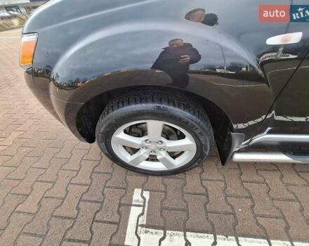 Черный Мицубиси Аутлендер ХЛ, объемом двигателя 2.36 л и пробегом 211 тыс. км за 10500 $, фото 6 на Automoto.ua