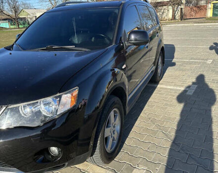 Черный Мицубиси Аутлендер ХЛ, объемом двигателя 2.4 л и пробегом 198 тыс. км за 11000 $, фото 4 на Automoto.ua