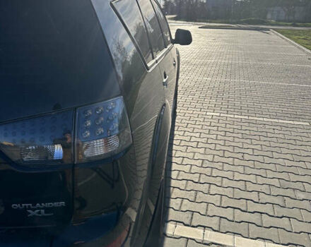 Черный Мицубиси Аутлендер ХЛ, объемом двигателя 2.4 л и пробегом 198 тыс. км за 11000 $, фото 8 на Automoto.ua