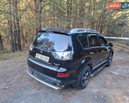 Черный Мицубиси Аутлендер ХЛ, объемом двигателя 2.4 л и пробегом 127 тыс. км за 10500 $, фото 24 на Automoto.ua