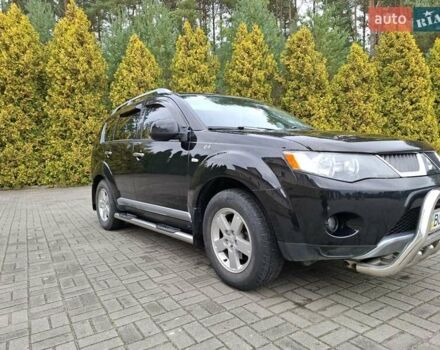 Черный Мицубиси Аутлендер ХЛ, объемом двигателя 2.4 л и пробегом 127 тыс. км за 10500 $, фото 1 на Automoto.ua