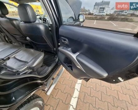 Черный Мицубиси Аутлендер ХЛ, объемом двигателя 2.36 л и пробегом 211 тыс. км за 10500 $, фото 17 на Automoto.ua