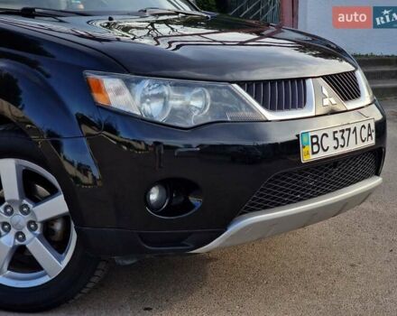 Черный Мицубиси Аутлендер ХЛ, объемом двигателя 2.36 л и пробегом 180 тыс. км за 7800 $, фото 1 на Automoto.ua