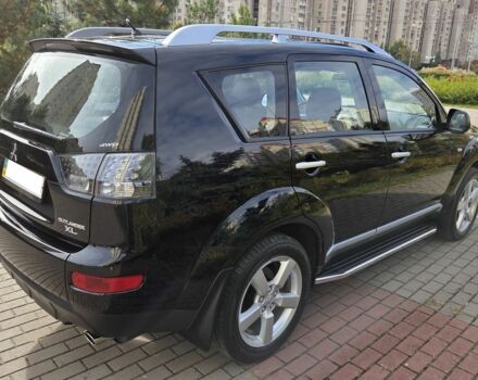 Черный Мицубиси Аутлендер ХЛ, объемом двигателя 2.4 л и пробегом 31 тыс. км за 15000 $, фото 3 на Automoto.ua