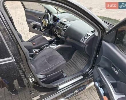 Черный Мицубиси Аутлендер ХЛ, объемом двигателя 2.4 л и пробегом 127 тыс. км за 10500 $, фото 35 на Automoto.ua