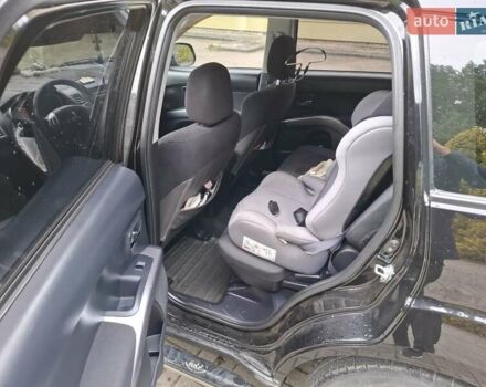 Черный Мицубиси Аутлендер ХЛ, объемом двигателя 2.4 л и пробегом 127 тыс. км за 10500 $, фото 33 на Automoto.ua